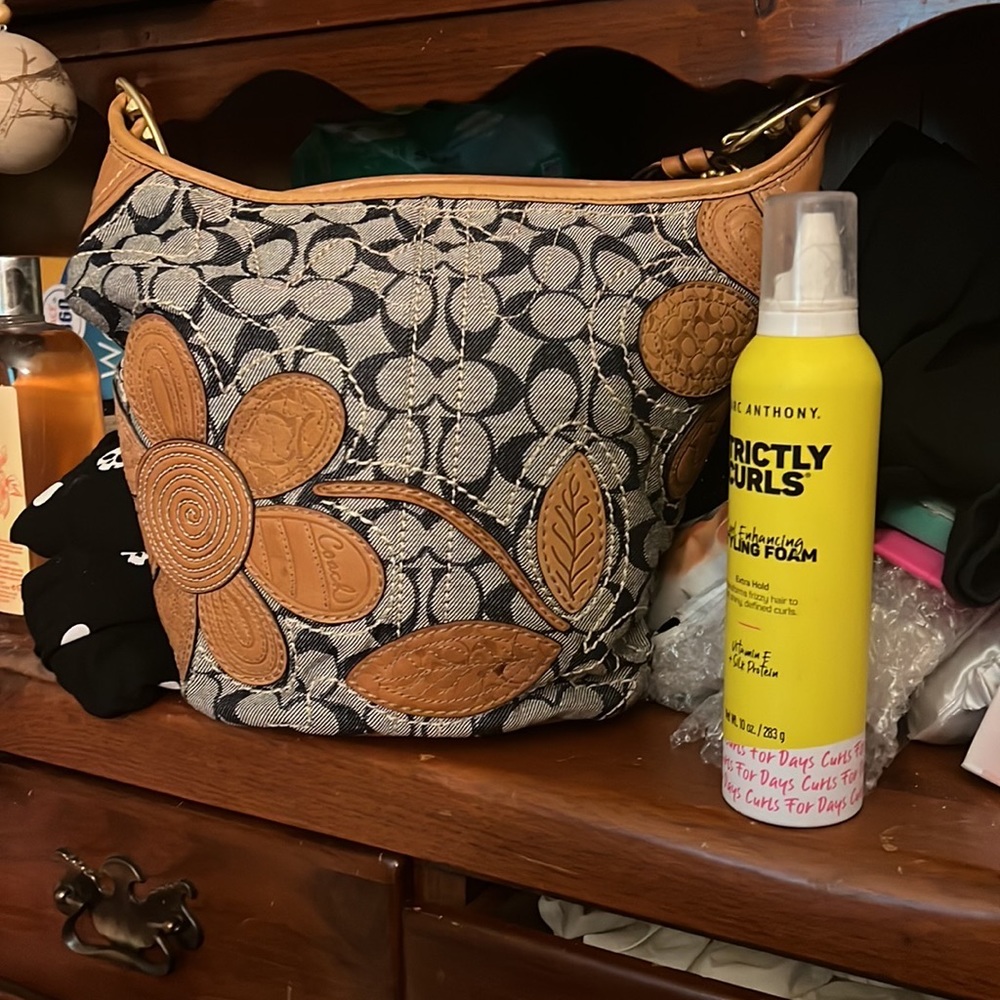 Coach denim tooled floral vachetta wallet. Matching shoulder bag.